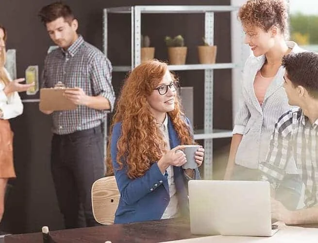 People collaborating in a workplace, from the original Perivana About page